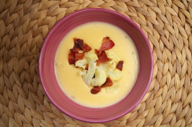 Cheese Soup with Roasted Cauliflower and Bacon -- Smooth, creamy and savory, this cheese soup is made unique by adding roasted cauliflower with a secret ingredient and garnished with bacon. | thatwhichnourishes.com