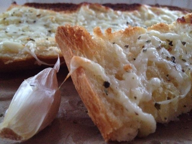 Cheesy, Easy Garlic Bread -- In just a few minutes with just a few simple pantry ingredients, you can make your own garlicky goodness boozing with cheese and spice. | thatwhichnourishes.com