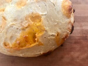 Artisan Cheese Bread -- Crispy on the outside, soft on the inside, this recipe makes two loaves of Artisan Cheese Bread that may be the easiest most amazing bread you've ever had. No kneading needed! | thatwhichnourishes.com