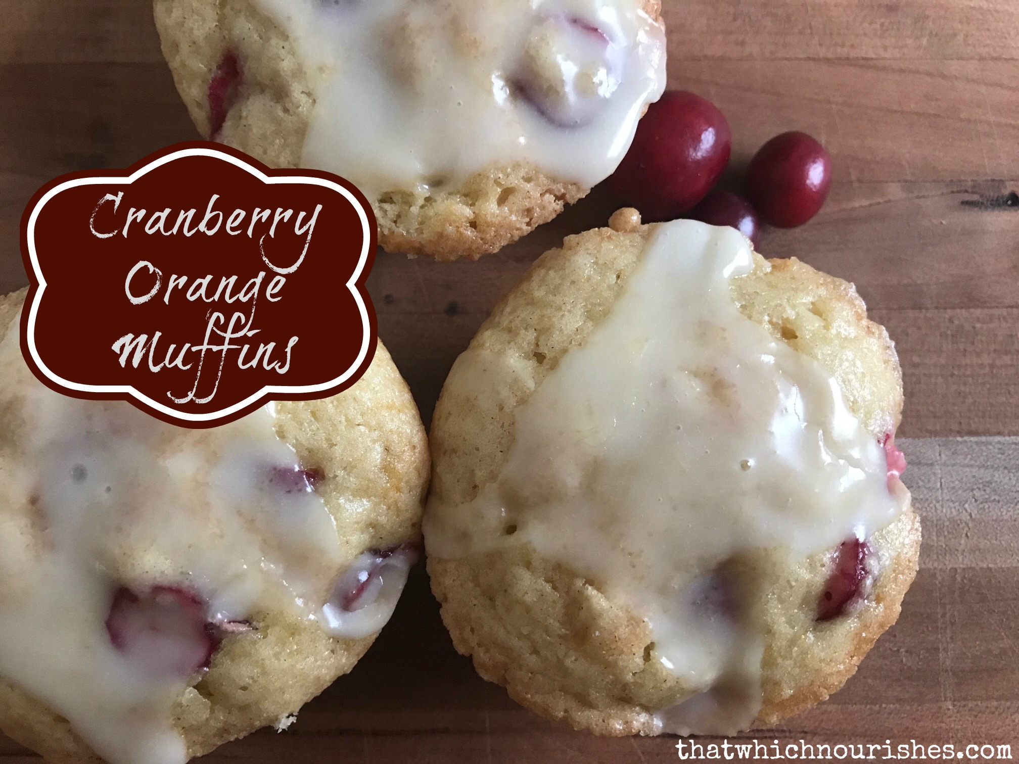 Glazed Cranberry Orange muffins -- A sweet, fluffy, orange-y muffin with little bursts of tart cranberry, covered with a tangy sweet orange glaze. | thatwhichnourishes.com