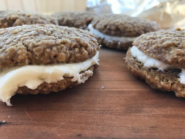 Oatmeal Cream Pies -- Pillowy soft buttery frosting is sandwiched between two soft oatmeal cookies spiced to perfection. | thatwhichnourishes.com
