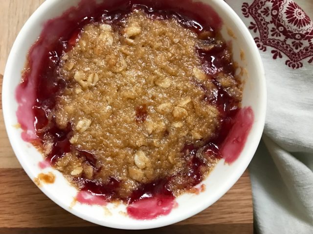 Tart Cherry Crisp -- Warm, tart cherries nestled like a pie under a blanket of crisp topping of oats and brown sugar. | thatwhichnourishes.com
