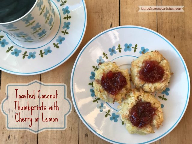 Coconut Thumbprints with Cherry or Lemon -- Buttery shortbread cookies are covered in coconut and filled with tart jam or homemade lemon curd for a rich cookie in a beautiful little bundle of yum. | thatwhichnourishes.com