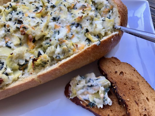 Four Spinach Artichoke Dip -- Four cheeses combine perfectly with garlic, spinach, and artichokes to create the very best version of this classic dip we all love. Bake it in a bread bowl for ultimate dipping pleasure. | thatwhichnourishes.com