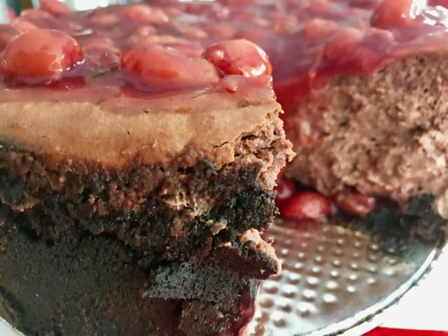 Steel Magnolias Chocolate Cherry Cheesecake -- A decadent and creamy chocolate cheesecake is encrusted with two kinds of buttery, chocolate crumbs and layered with cherries to make a delightful dessert for any special occasion. | thatwhichnourishes.com