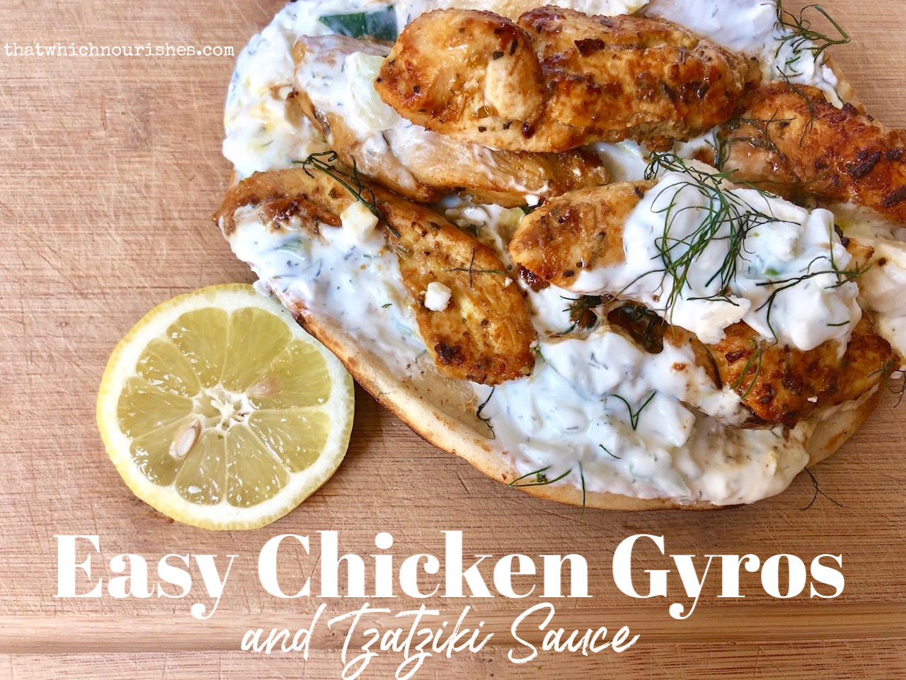 Easy Chicken Gyros and Tzatziki Sauce -- Marinated chicken piled on naan bread and blanketed with homemade tzatziki sauce loaded with garlic, dill, and cucumbers and then covered in rich feta. | thatwhichnourishes.com