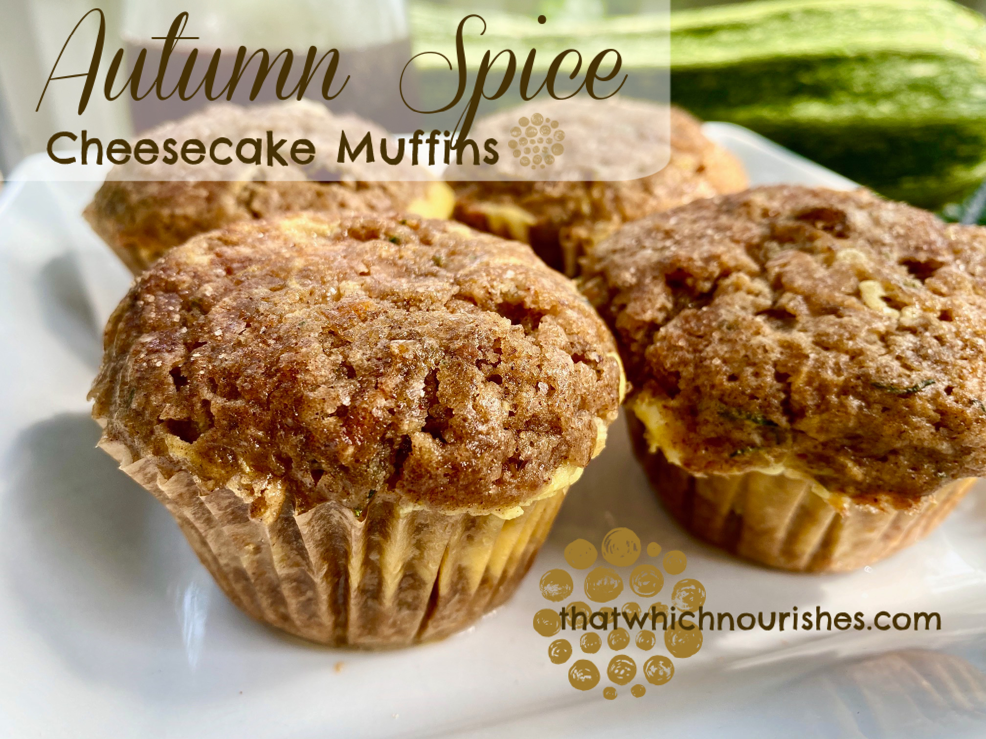 Autumn Spiced Cheesecake Muffins -- Soft, moist muffins spiced with all the warm, Autumn spices and layered with stripe of cheesecake-goodness. Filled with zucchini, carrots, coconut oil, and maple syrup, these beauties are as nourishing as they are delicious! | thatwhichnourishes.com