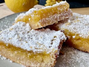 Luscious Lemon Bars -- These lemon bars have a shortbread crust, a tart, creamy center, and a pile of soft, sweet sugar on top -- just how a lemon dessert should taste. | thatwhichnourishes.com